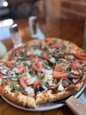 Beaus Special Fresh basil, fresh tomatoes, pepperoni, sausage, mushrooms, Kalamata olives, roasted onions, garlic, and feta.