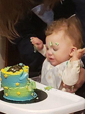 My granddaughter eating cake on her 1 birthday