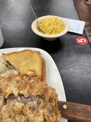Chicken fried steak and a side of corn