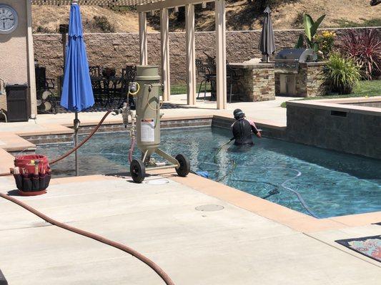 Mary working along the edge of the pool