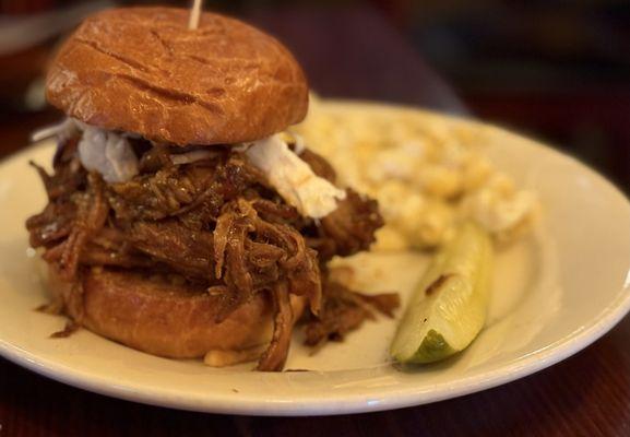 Pulled pork sandwich and macaroni and cheese.