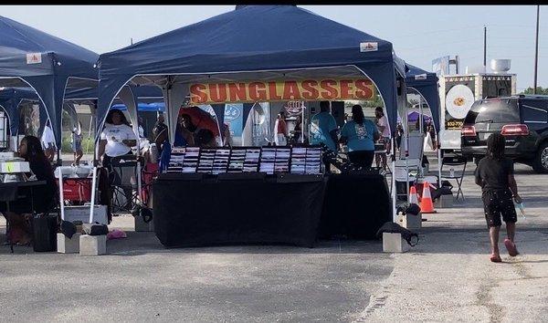 Sunglass booth during Inaugural Weekend opening of the Houston Grub Hub, a group of Black owned small business & food truck owner/operators.