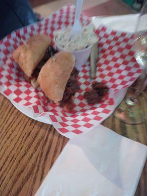 BBQ chicken dinner with beans and Cole slaw