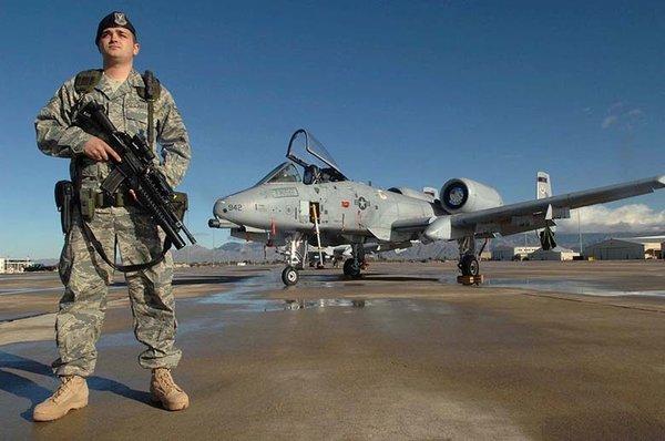 Air Force Security Forces Defender guarding an A-10.