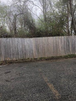 Fence falling over - pavement corroding. line spacing fading Plaza Place Condos 5/2018 you see it as soon as you arrive on the property