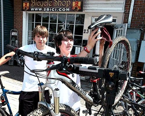 Ryan and Conner washing bikes.