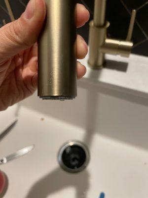 Brand new faucet scratched from them trying to fix water pressure.