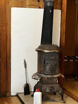 Wood burning stove in Cabin 10