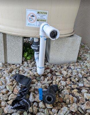 Damage to the rain barrel caused by worker