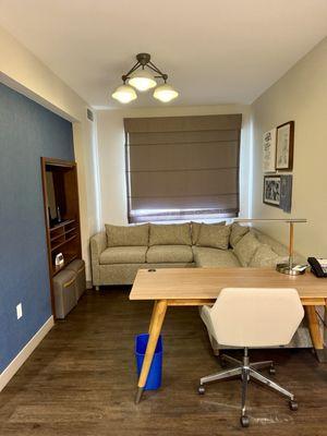 Sitting room off the kitchen has a desk which was handy