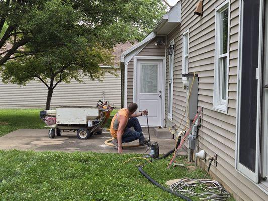 Andrew pumping the product under the slab.