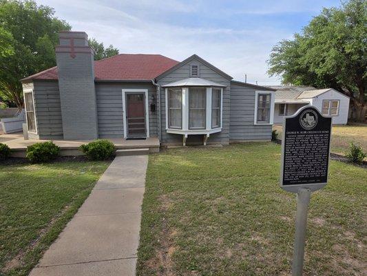 Front of the house with 1 of 2 plaques