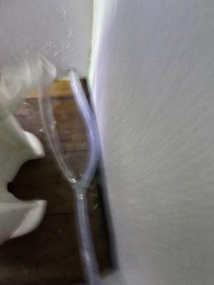 bursted water tubing in bathroom