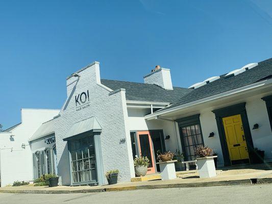 Koi Salon is in a cute and quaint white building easily spotted along North New Braunfels Avenue :) !