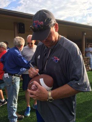 8/19/16. Friday evening. Louisiana Tech Football Fan Fest!! Head Coach Skip Holtz signing a football!!