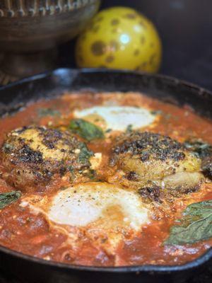 This is can tomatoes ( Laura Lynn), cooked with spinach and some poached eggs. Shakshuka- great breakfast from ingles...