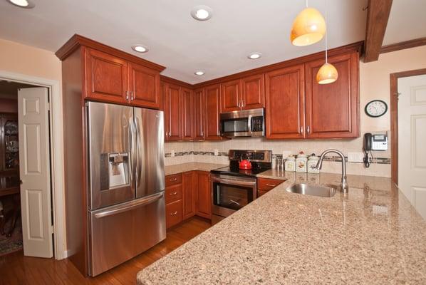 These are Lancaster Maid Cabinets in a Cherry Heirloom finish. As you can see, even a small kitchen can look stunning.