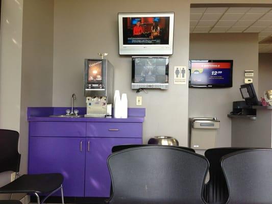 Clean waiting area, with hot chocolate/French vanilla cappuccino dispenser.