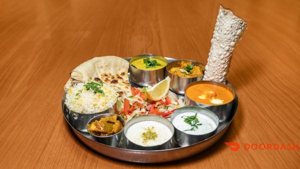 Lunch thali ( a sampler dish with different varieties of curries)