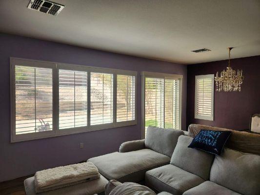 White Shutters on Purple Walls