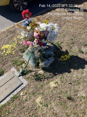 My mother's vase on her headstone flowers, pull out a vase and thrown on the ground