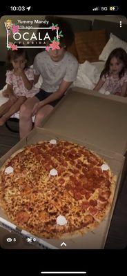 Huge pizza is bigger than my 5'8" 13 year old!