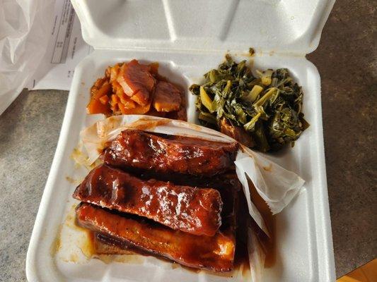 Rib dinner with yams and Colored greens..
