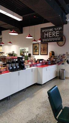 Where you pick up food. A variety of sugar and creamer