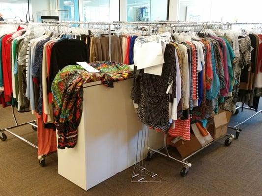 Racks and racks of TravelSmith apparel which are being evaluated before being added to their catalog.