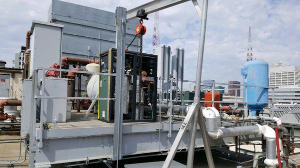 Boiler getting set on the equipment pad. Just needed two more lifts to finally get it set in place.