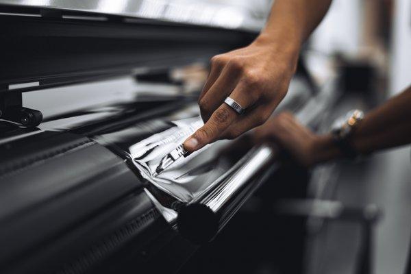 Cutting our window film that was just cut by our plotter.