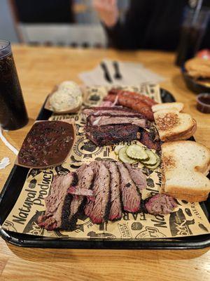 Pork ribs, brisket, sausage, beans, and potato salad