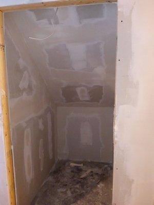 Showings hall closet in basement apartment remodel.