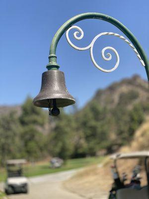 Ring the bell when done with the hole so the group behind on the blind elevated tee box can proceed.
