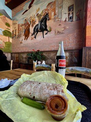 Inside with burrito & coke bottle