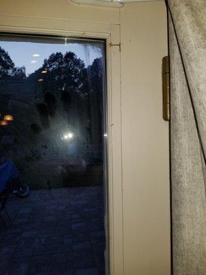 Huge staple in the upper right hand corner as well as smeared caulk and his handprint all over the glass. -That I was supposed to clean up.