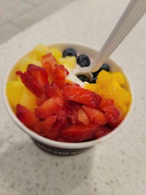 Half strawberry & half original base w strawberries, mangoes, pineapples, and blueberries.