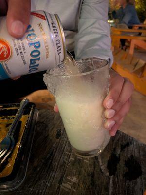 Can of Monopolio Lager Clara beer with an iced beer glass at The Key Miami on the rooftop of The Citadel.