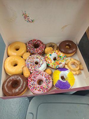 Dozen assorted donuts, minus one...someone couldn't wait.