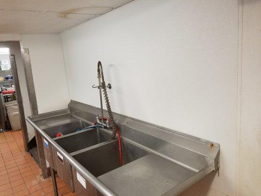 removed old FRP and installed new FRP next to commercial 3 compartment sink