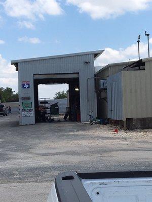 The tire shop is located behind the Buck Stop in Leakey, Texas.