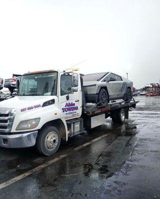 Transporting a Tesla Cybertruck for 24/7 Towing, Roadside, and Exotic transport call Able Towing 407-866-3464