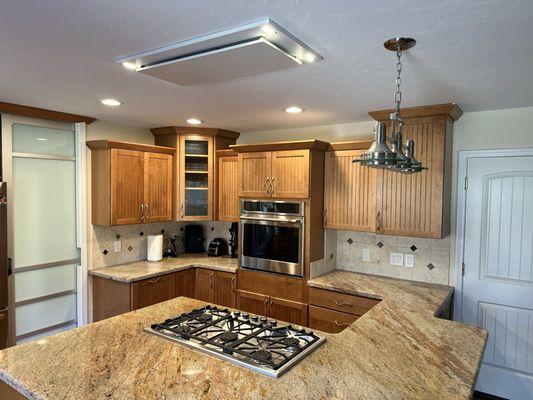New flush mount ceiling extractor fan unit controlled by a hardwired switch below the counter top.