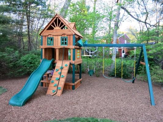 Broehl's recently dug out 6 inches of lawn and laid down playground matting for our kids' new swingset. Looks great!