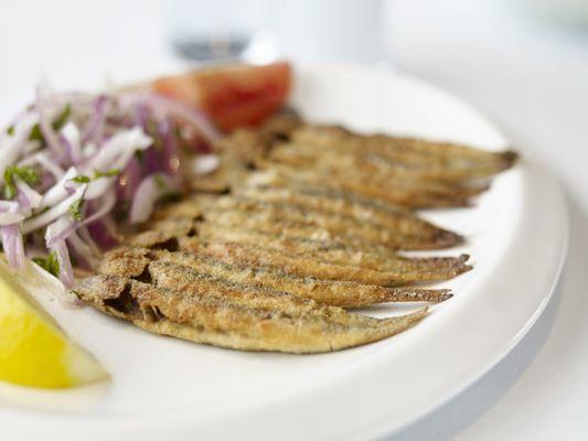 Our seasonal specialty: pan-fried anchovies. A Mediterranean delicacy.