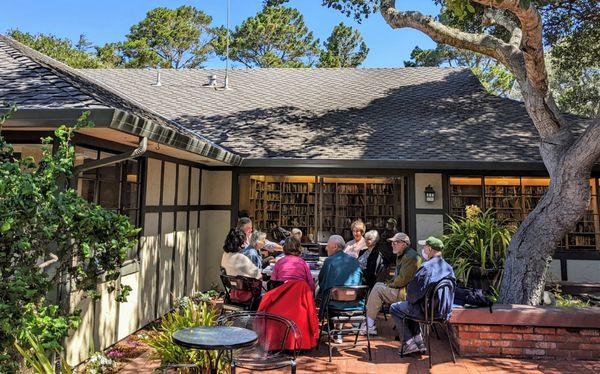 Our weekly memoir writing class meeting outside our lending library.