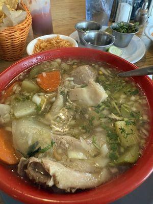 Chicken soup.  Comes with rice, tortillas, onions, cilantro and jalapeños