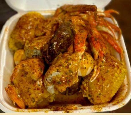 Sm. crab & shrimp order w/ sausage, corn on the cob, red potatoes, hard boiled eggs, and the best buttery garlic sauce on the planet.