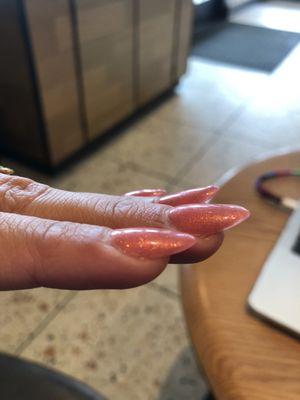 Lifted ring finger (left hand).