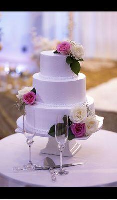 Our tres leches fruit filled wedding cake decorated at Abi's